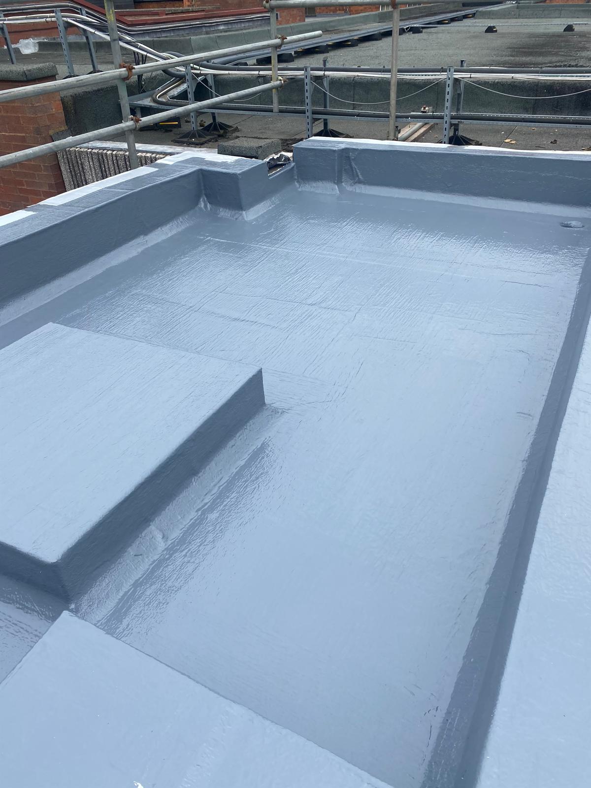 Installed liquid-applied waterproofing system on flat roof