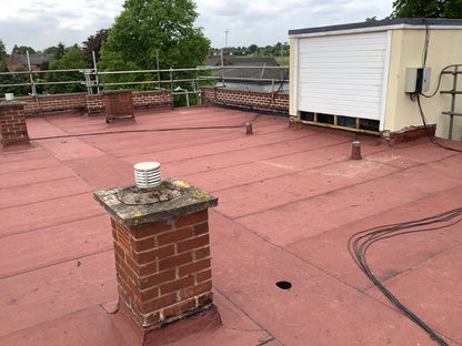 Installed bituminous AVCL roofing membrane within flat roof system
