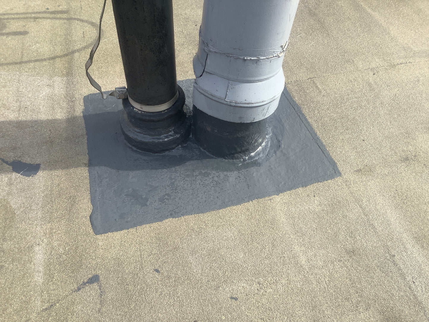 polyurethane roof coating applied to flat roof waterproofing system