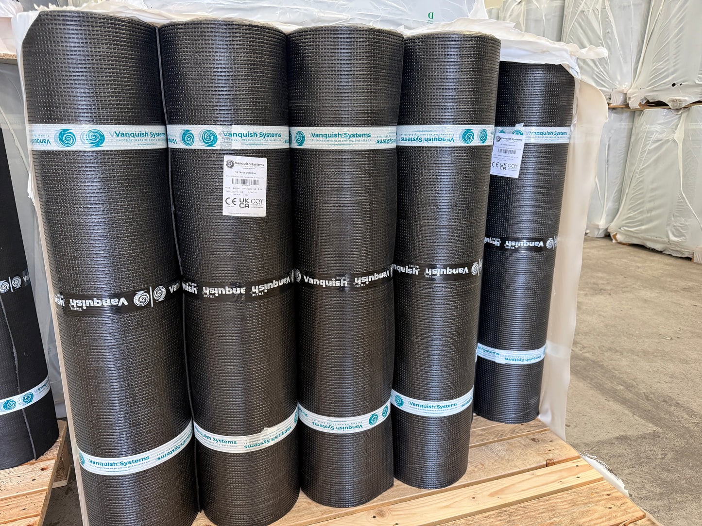 Pallet of Vanquish trade roofing felt underlay rolls ready for dispatch
