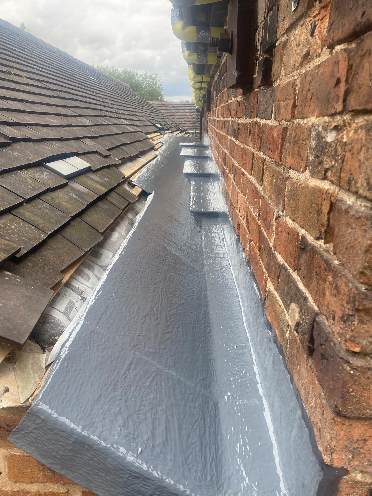 Liquid-applied waterproofing installed to flat roof detailing
