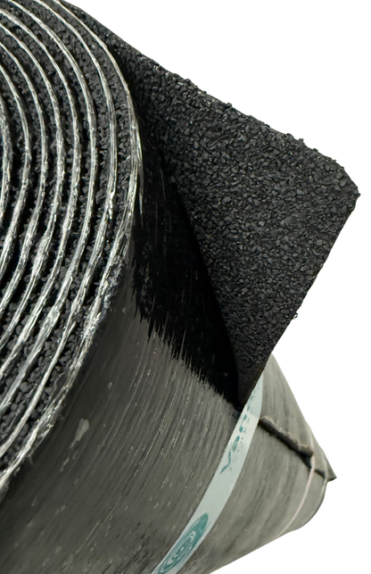 Detail view of Vanquish Pro SBS-modified torch-on roofing felt showing the mineral-finished upper surface and reinforced roofing membrane construction.