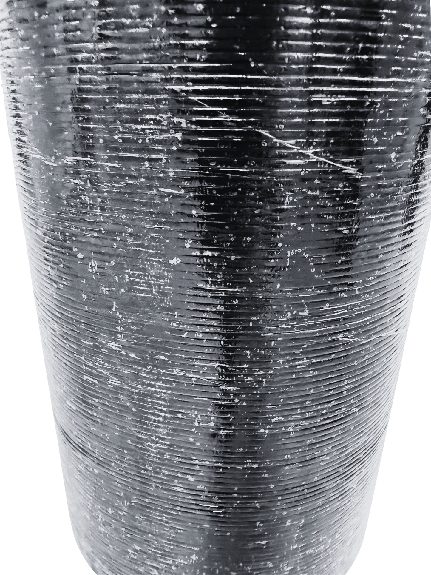 Grooved thermofusible underside film of Vanquish Pro SBS roofing felt designed to promote strong adhesion and efficient torch application during installation.