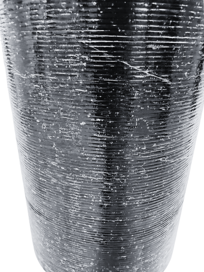 Grooved thermofusible underside film of Vanquish Pro SBS roofing felt designed to promote strong adhesion and efficient torch application during installation.